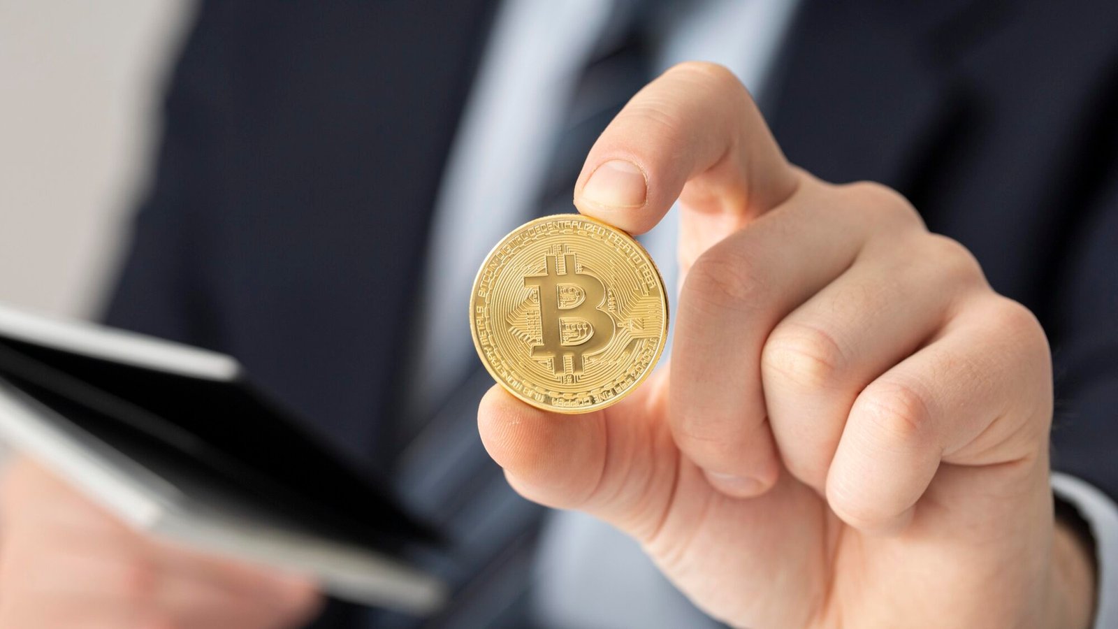businessman holding bitcoin close up